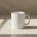 A clean, minimal lifestyle image for a personalised mugs collection.
A ceramic white mug placed on a warm neutral surface (cream and beige tones).
Soft natural daylight lighting, calm and premium feel.
Modern, minimal styling with lots of negative space.
The mug is plain and elegant, suitable for personalisation.
No people.
No text.
No logos.
No branding.
No busy props.
Editorial product photography style.
Timeless, gift-focused aesthetic.
Aspect ratio: square (1:1).
High resolution.